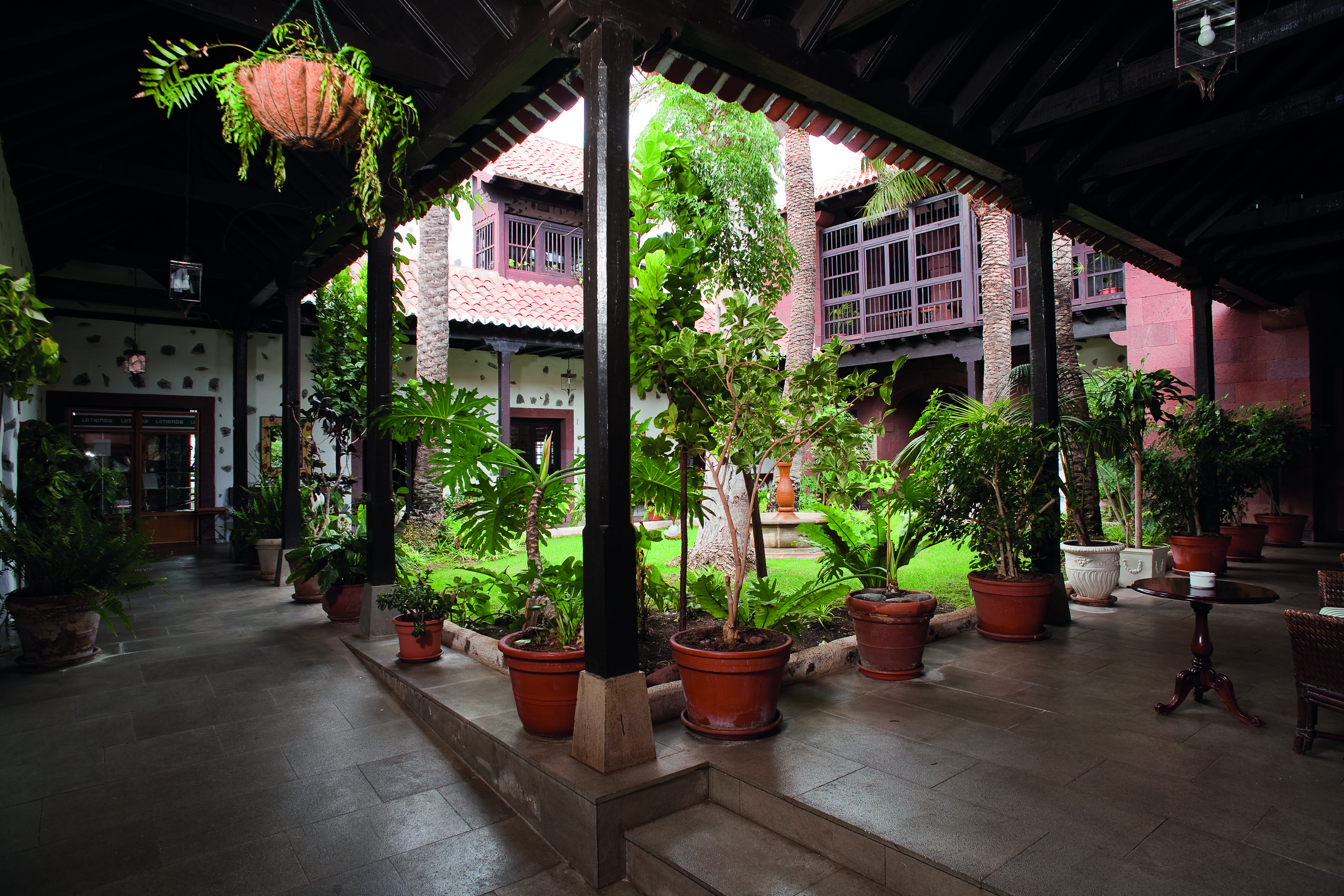 Patio bar area with tables and chairs set out in courtyard area