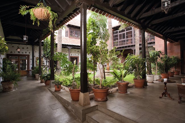 Patio bar area with tables and chairs set out in courtyard area