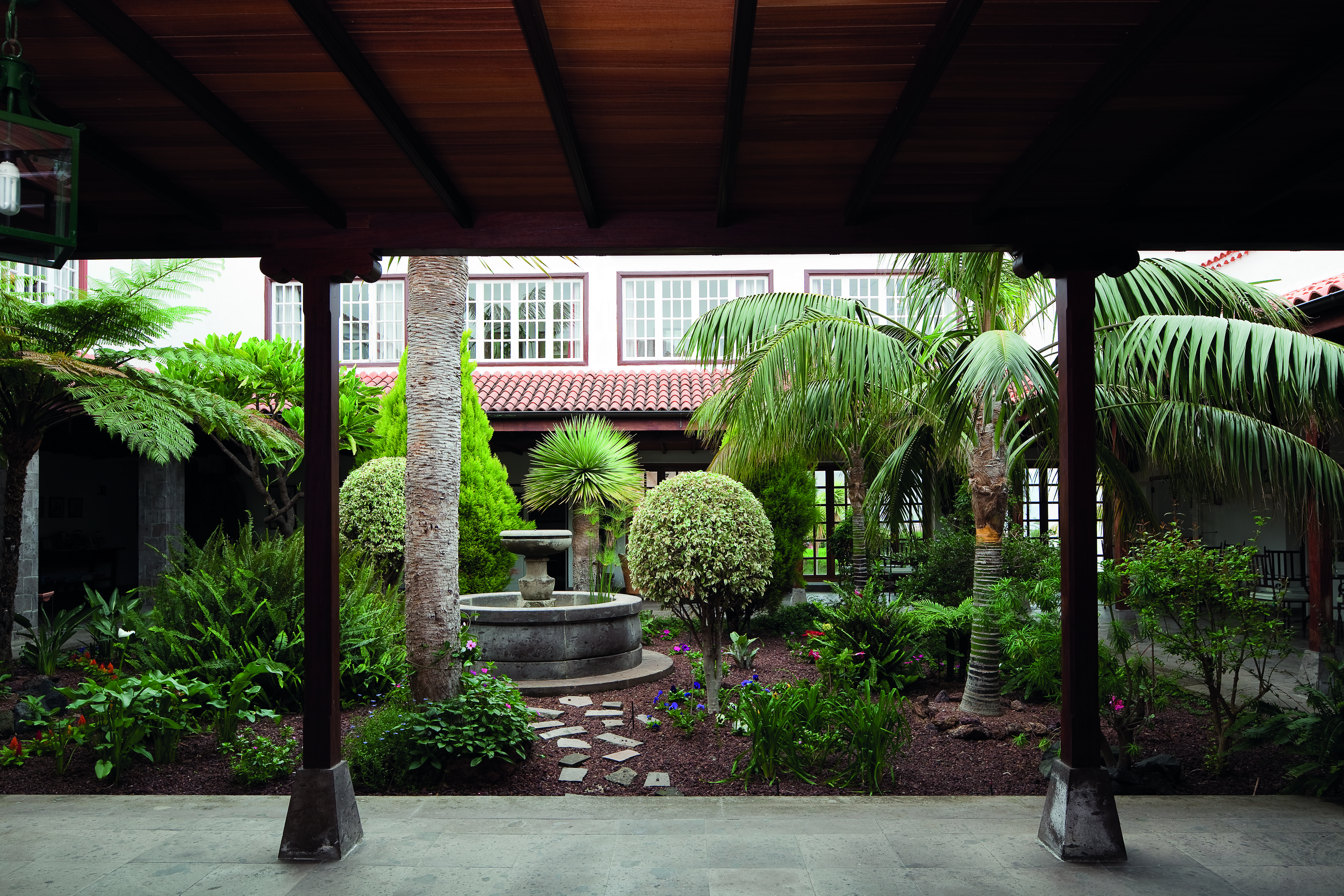 Courtyard with gardens and fountain inside the hotel