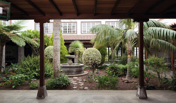 Courtyard with gardens and fountain inside the hotel