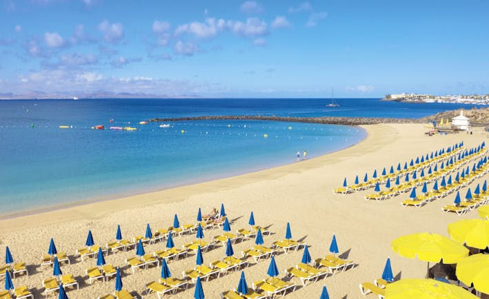 Princesa Yaiza beach, golden sand, blue sea, sun loungers, umbrellas