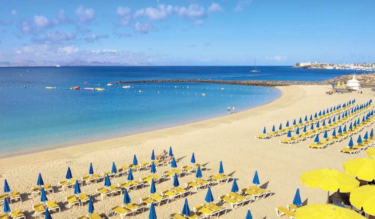 Princesa Yaiza beach, golden sand, blue sea, sun loungers, umbrellas