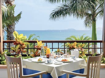 Princesa Yaiza table on private balcony set for breakfast, views over the sea