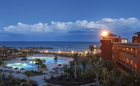 Sheraton Fuerteventura Canary Islands pools at night sea in background palm trees