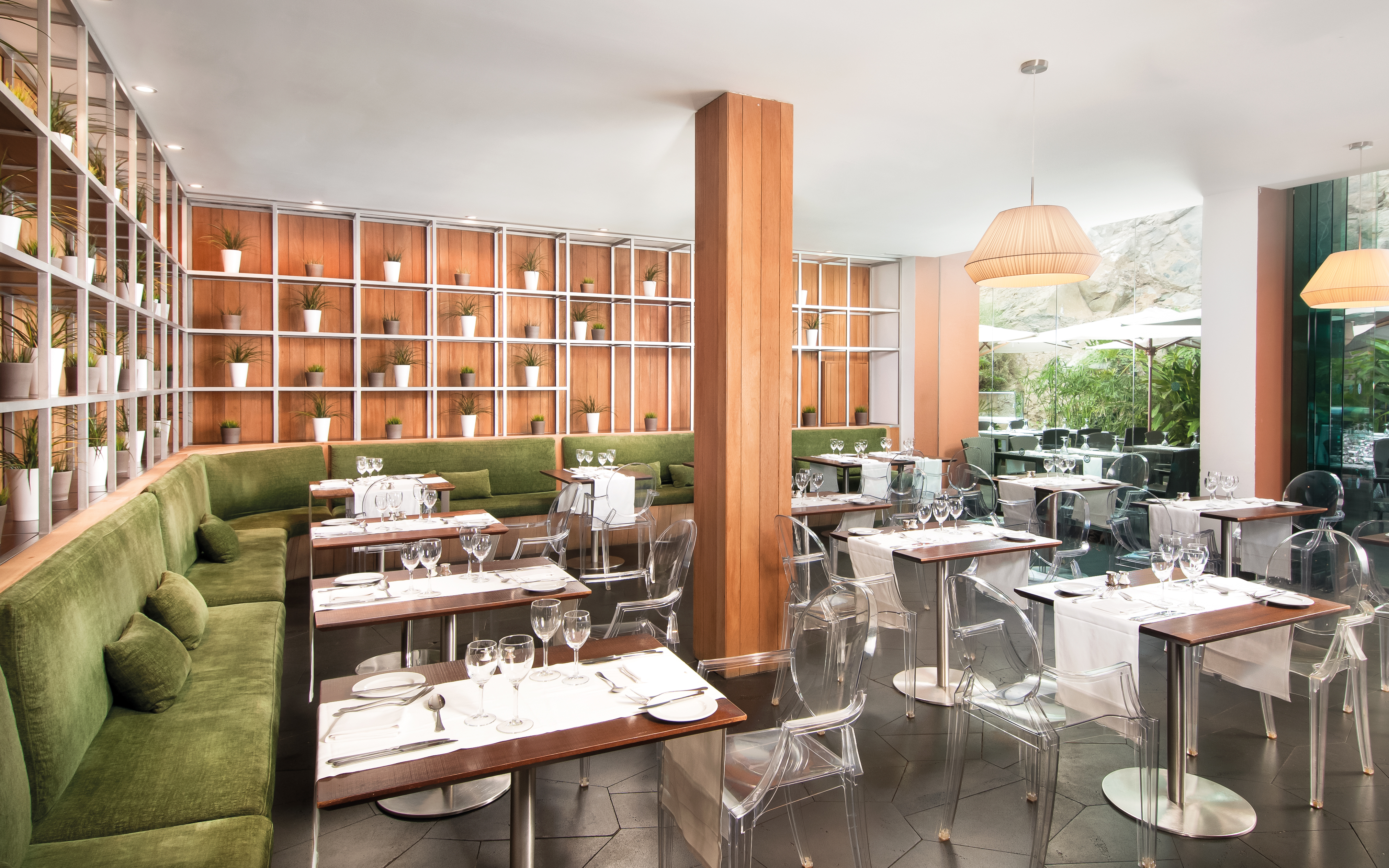 Golfio restaurant with green booth seating areas 