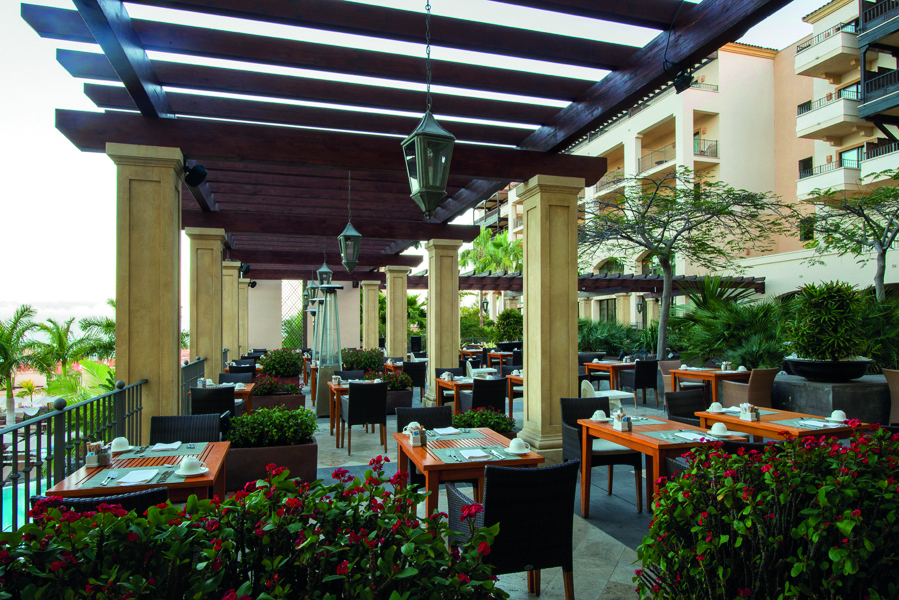 La Plantacion del Sur Tenerife outdoor dining area trees red flowers