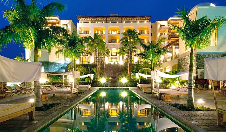 La Plantacion del Sur Tenerife exterior at night pool hotel lit up canopied sun loungers