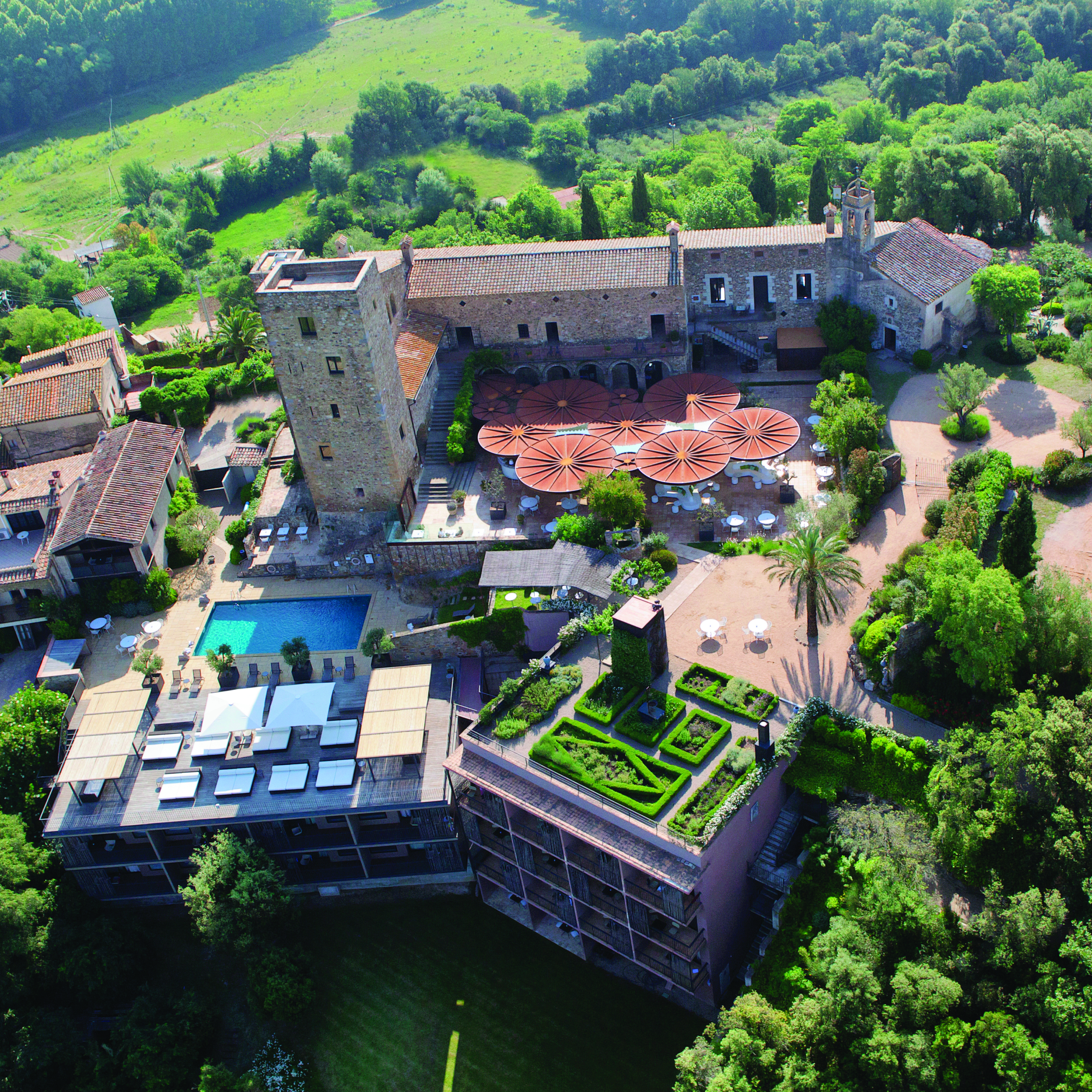 Castell D'Emporda Eastern Spain aerial shot hotel building pool gardens
