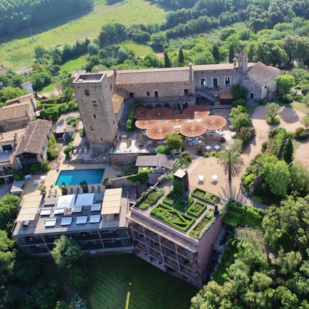 Castell D'Emporda Eastern Spain aerial shot hotel building pool gardens
