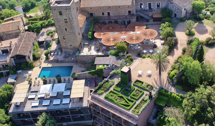 Castell D'Emporda Eastern Spain aerial shot hotel building pool gardens