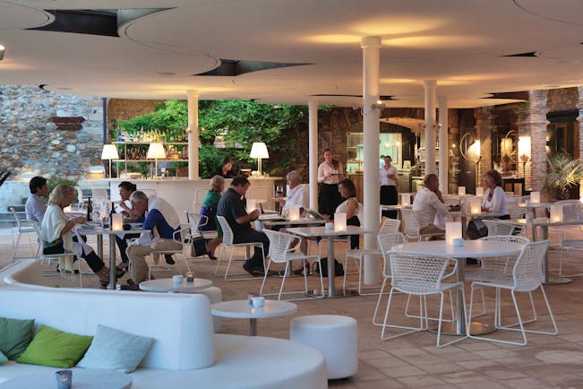 Castell D'Emporda Eastern Spain bar terrace diners tables and chairs