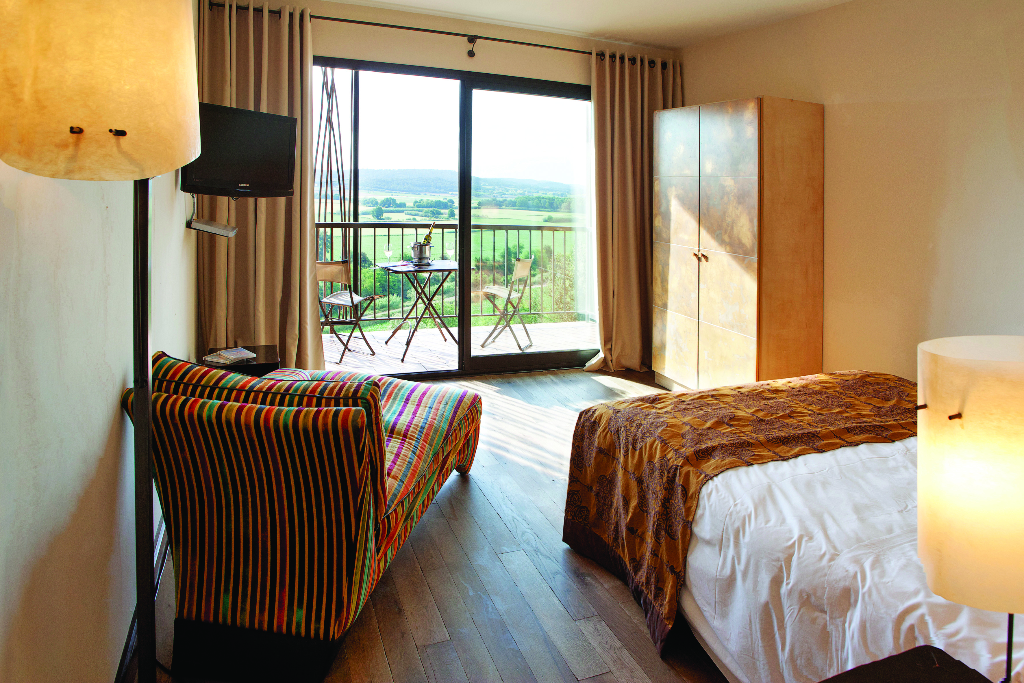 Castell D'Emporda Eastern Spain garden room bed chaise longue balcony countryside views