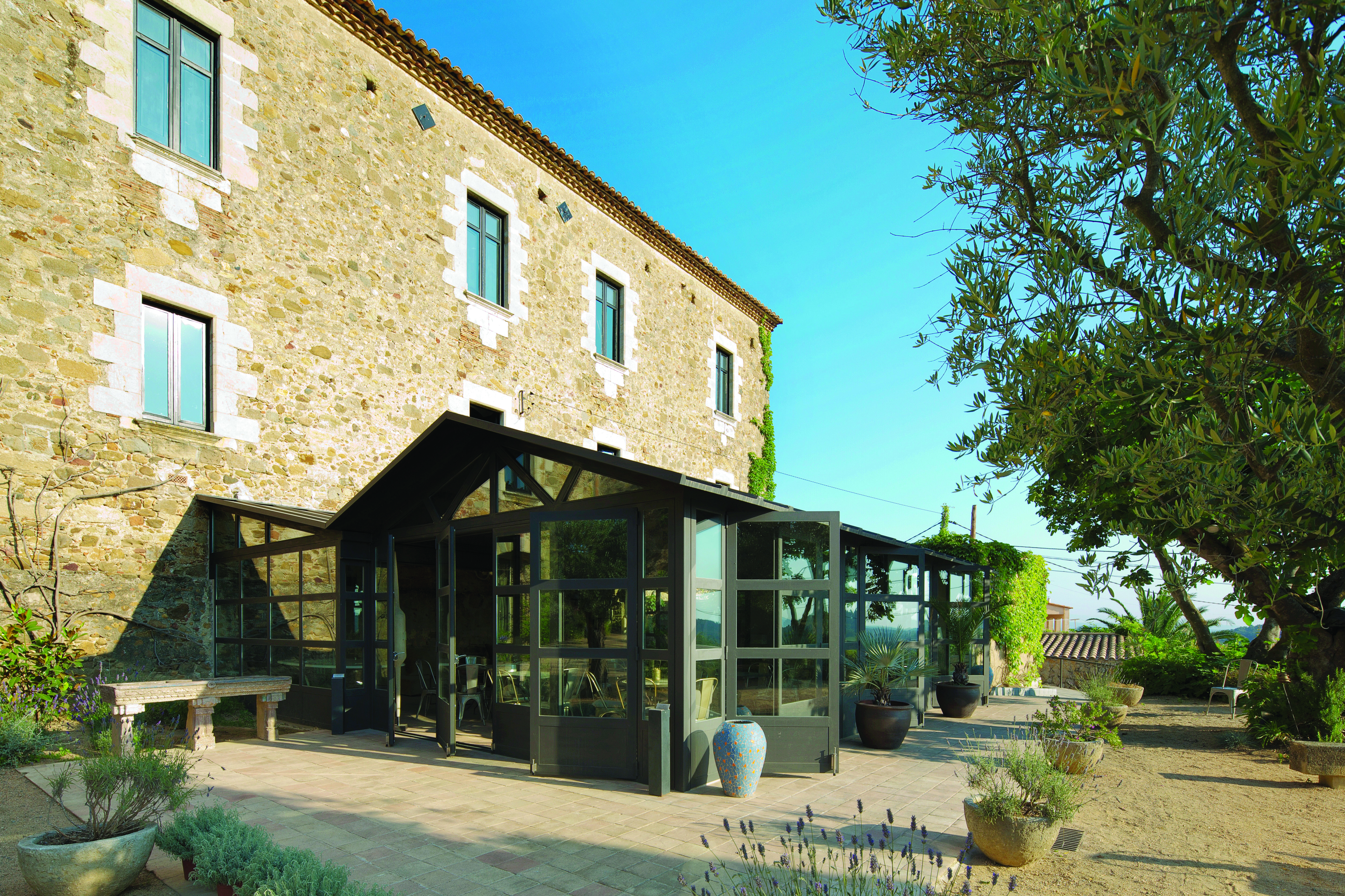Castell D'Emporda Eastern Spain restaurant exterior patio gardens trees