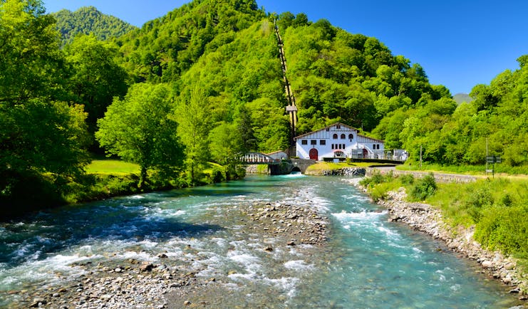 Mountain river with small half timebered house in the Spanish Pyrenees