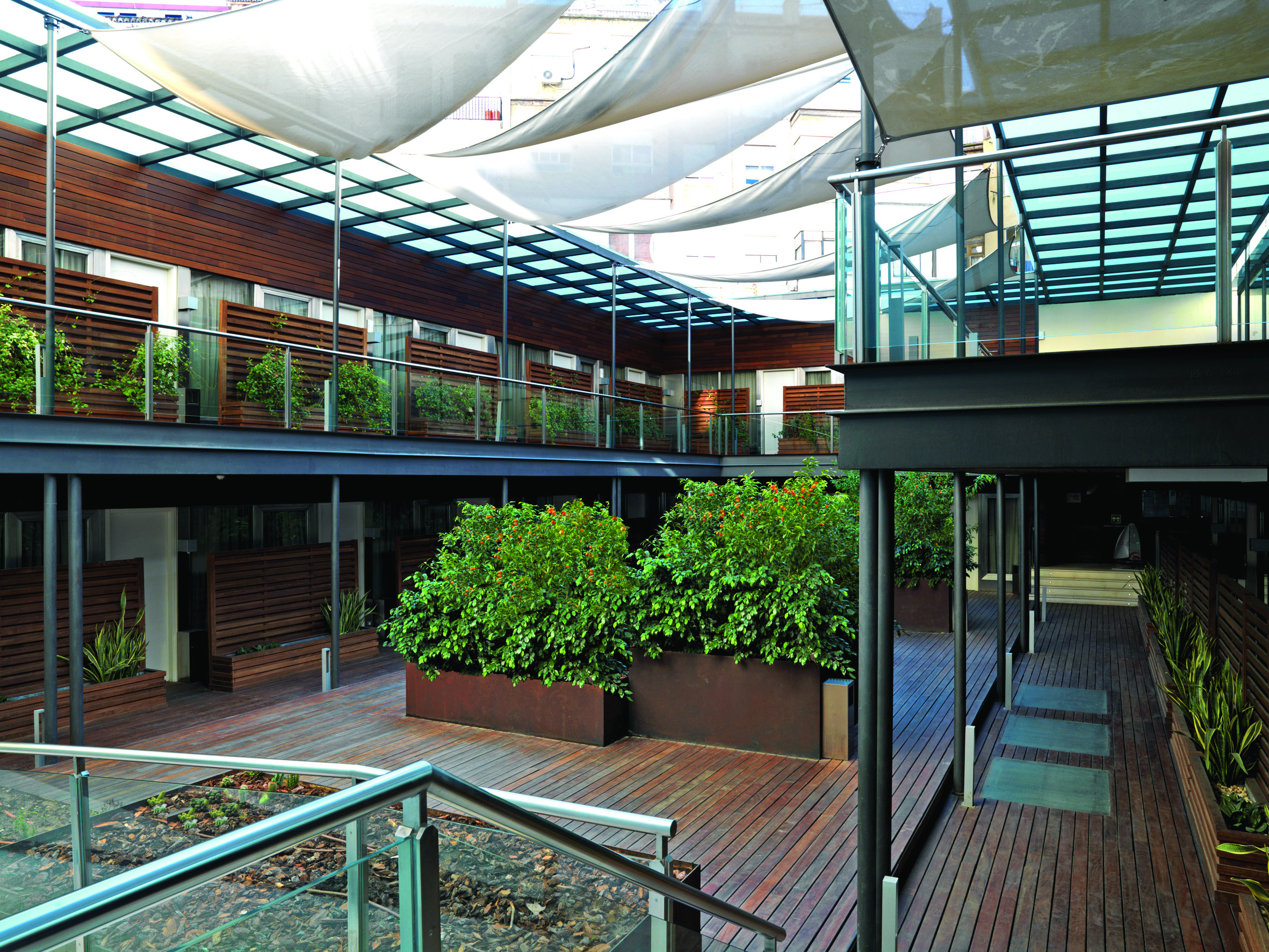 Hospes Palau de la Mar Valencia courtyard landings modern architecture shrubbery