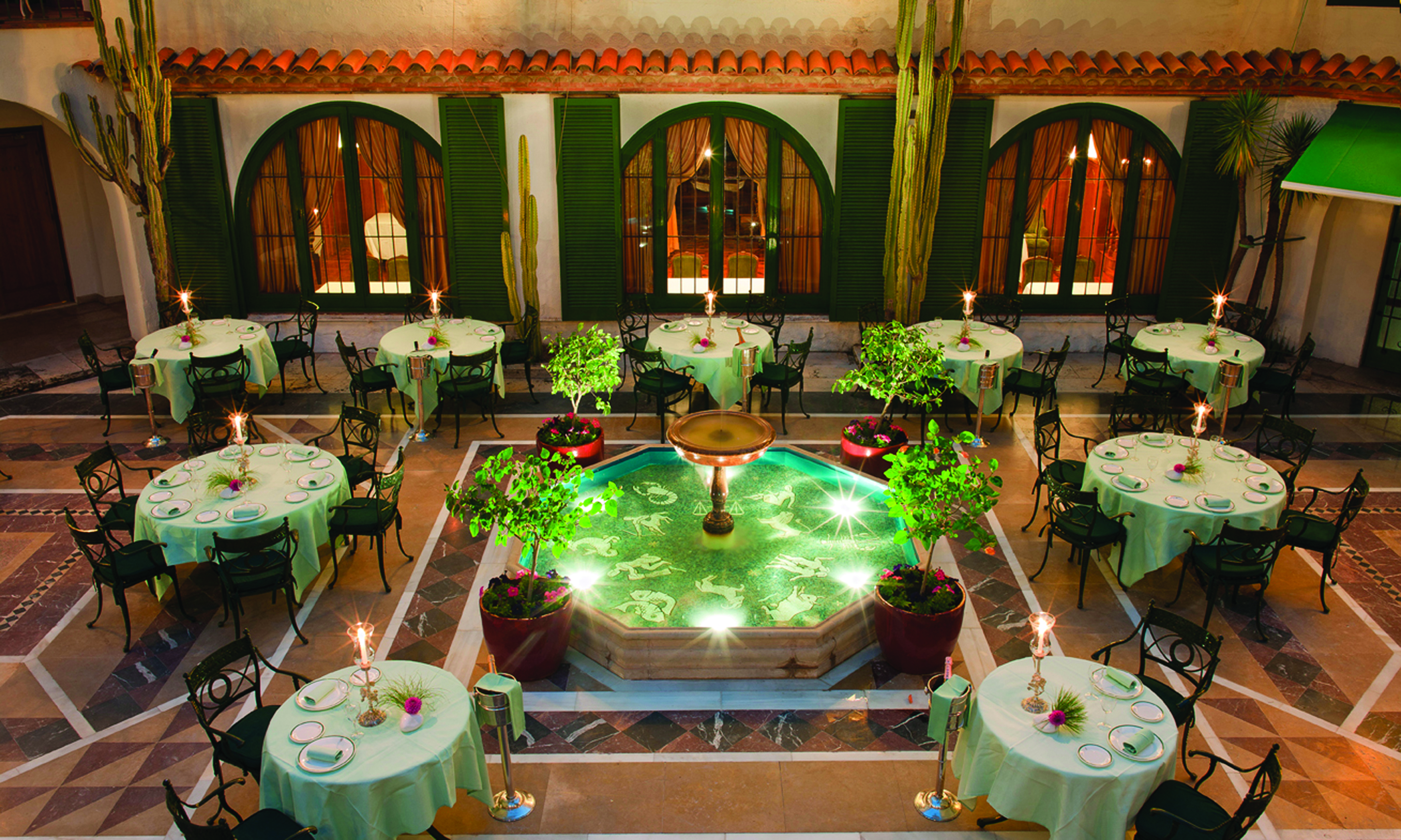 Hostal de la Gavina Catalonia courtyard restaurant tables and chairs water feature