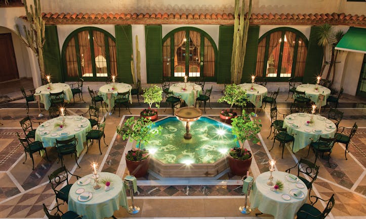 Hostal de la Gavina Catalonia courtyard restaurant tables and chairs water feature