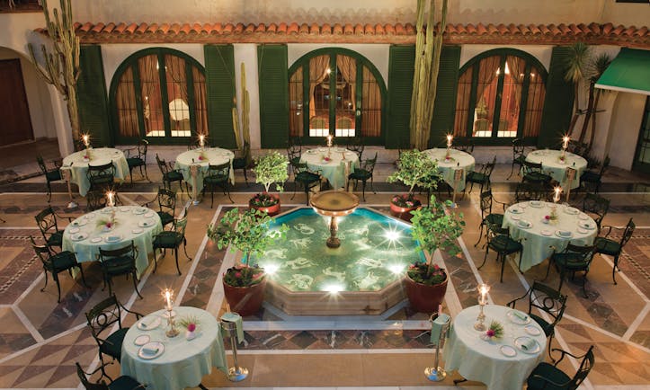 Hostal de la Gavina Catalonia courtyard restaurant tables and chairs water feature