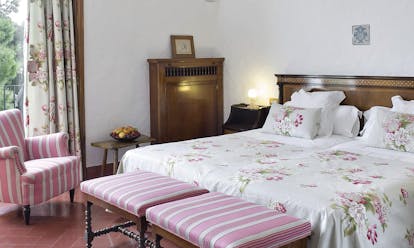 Hostal de la Gavina Catalonia family room bed armchair traditional décor