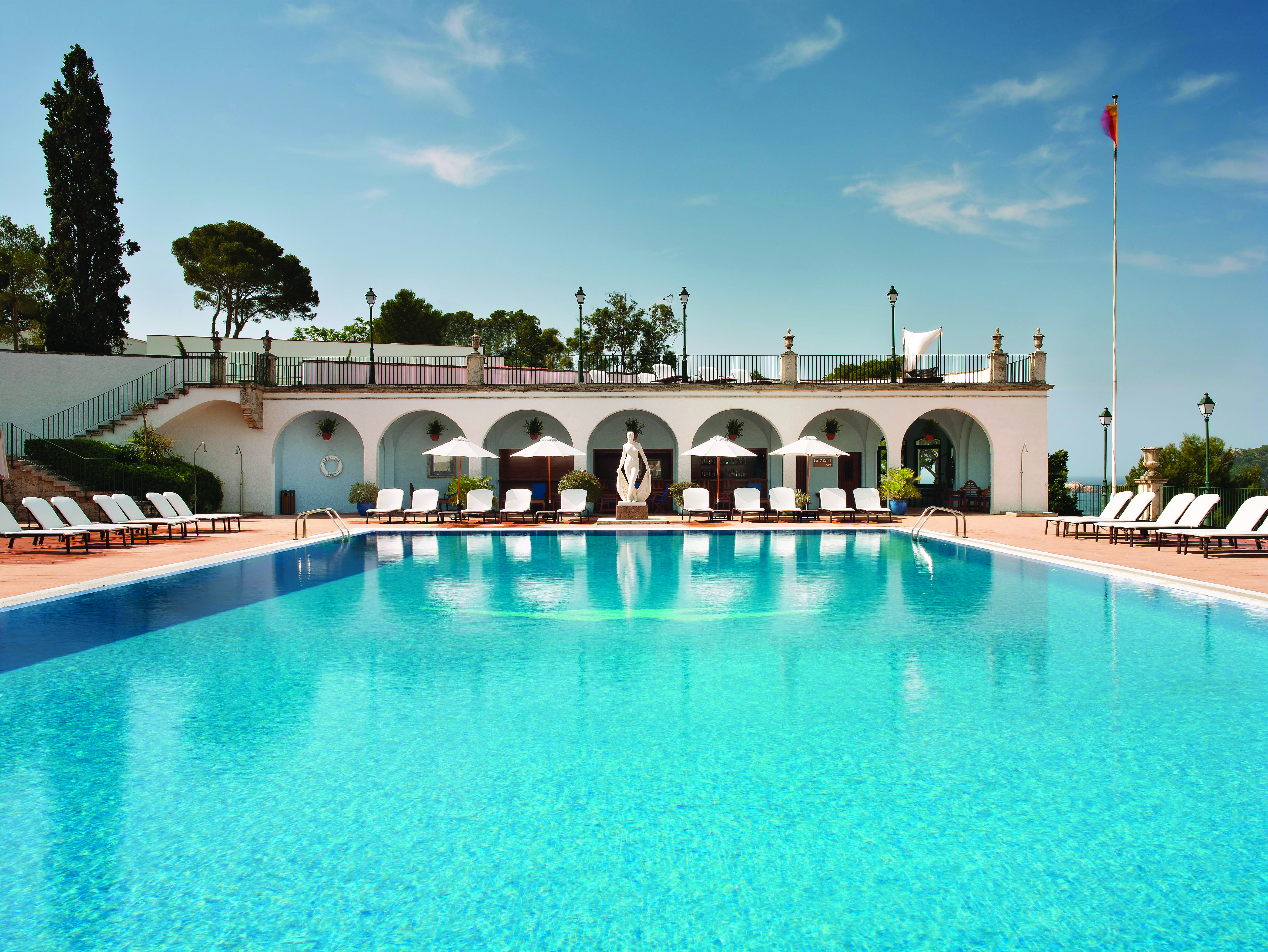 Hostal de la Gavina Catalonia pool sun loungers umbrellas