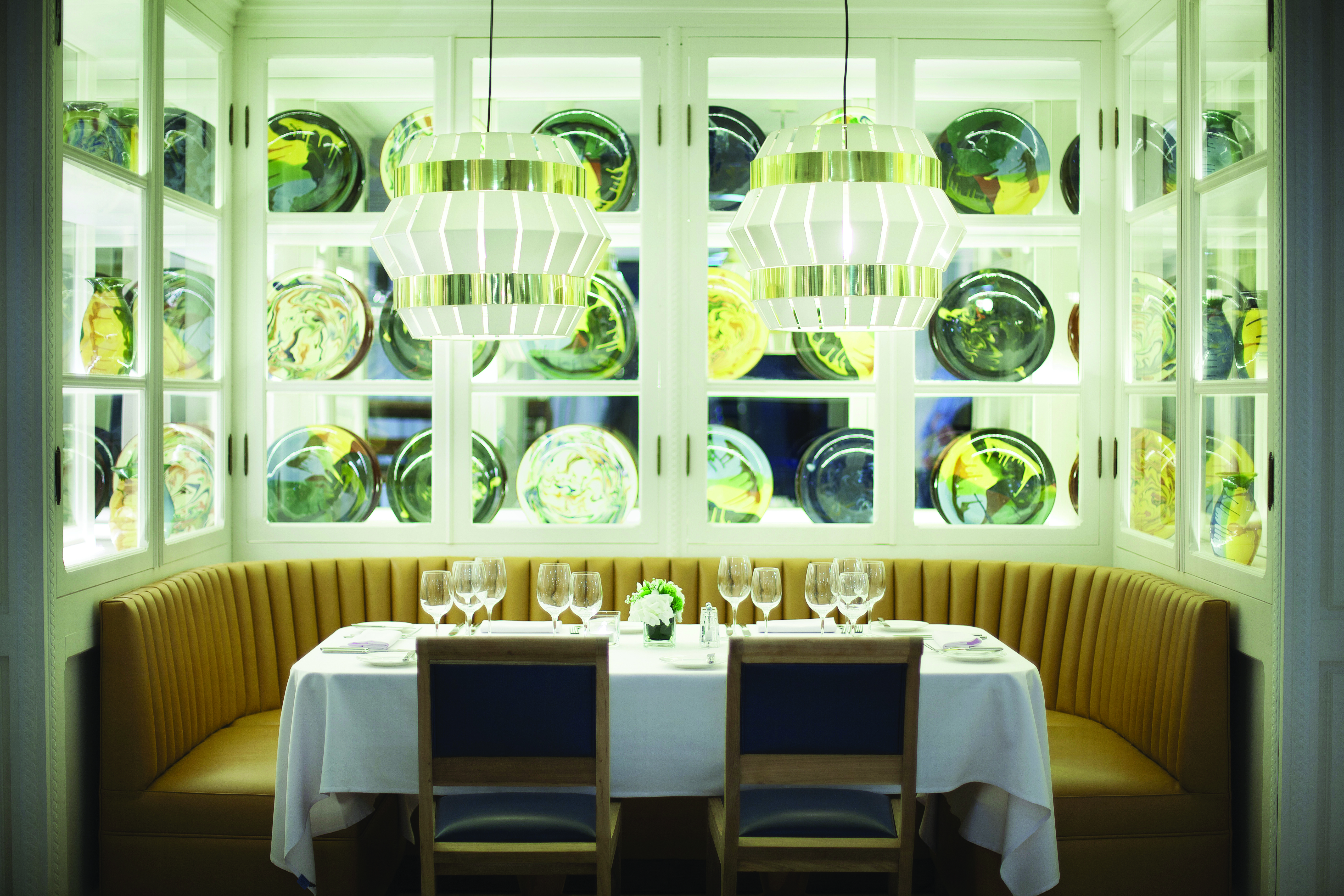 Hotel Camiral bar, booth, round leather seat, chairs, glass lamps, modern decor