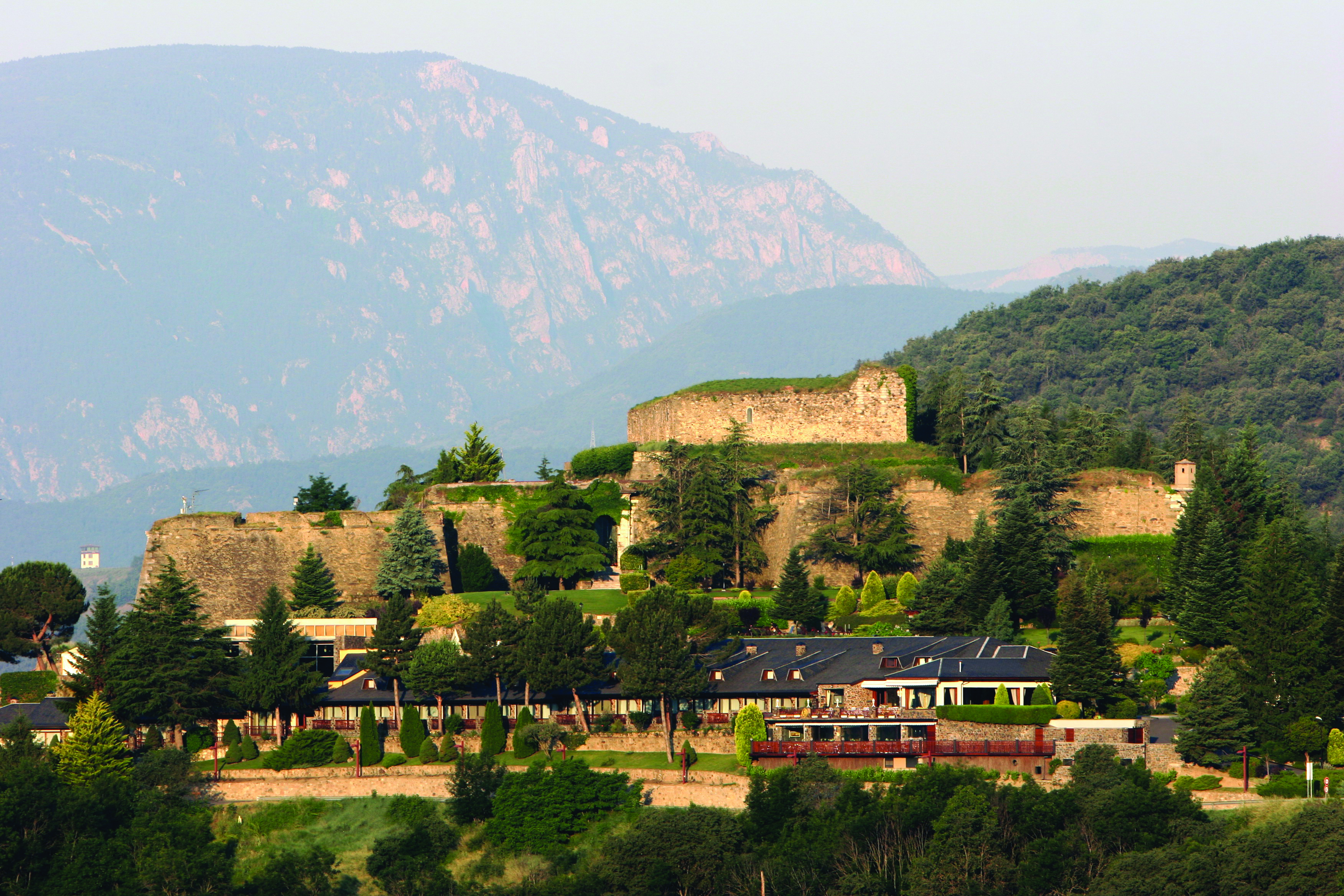 Hotel el Castell de Ciutat Catalonia exterior hotel building mountains in background