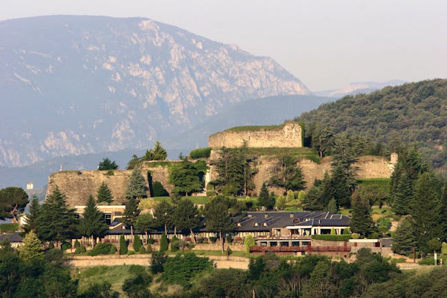 Hotel el Castell de Ciutat Catalonia exterior hotel building mountains in background