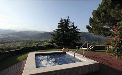 Hotel el Castell de Ciutat Catalonia hot tub outdoor terrace views of mountains and countryside