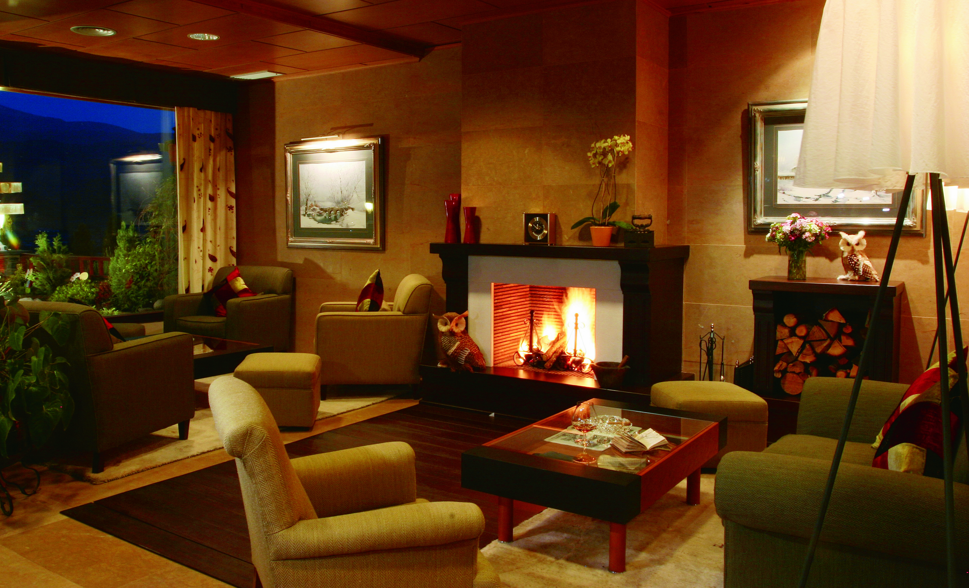 Hotel el Castell de Ciutat Catalonia lounge indoor seating armchairs open fire
