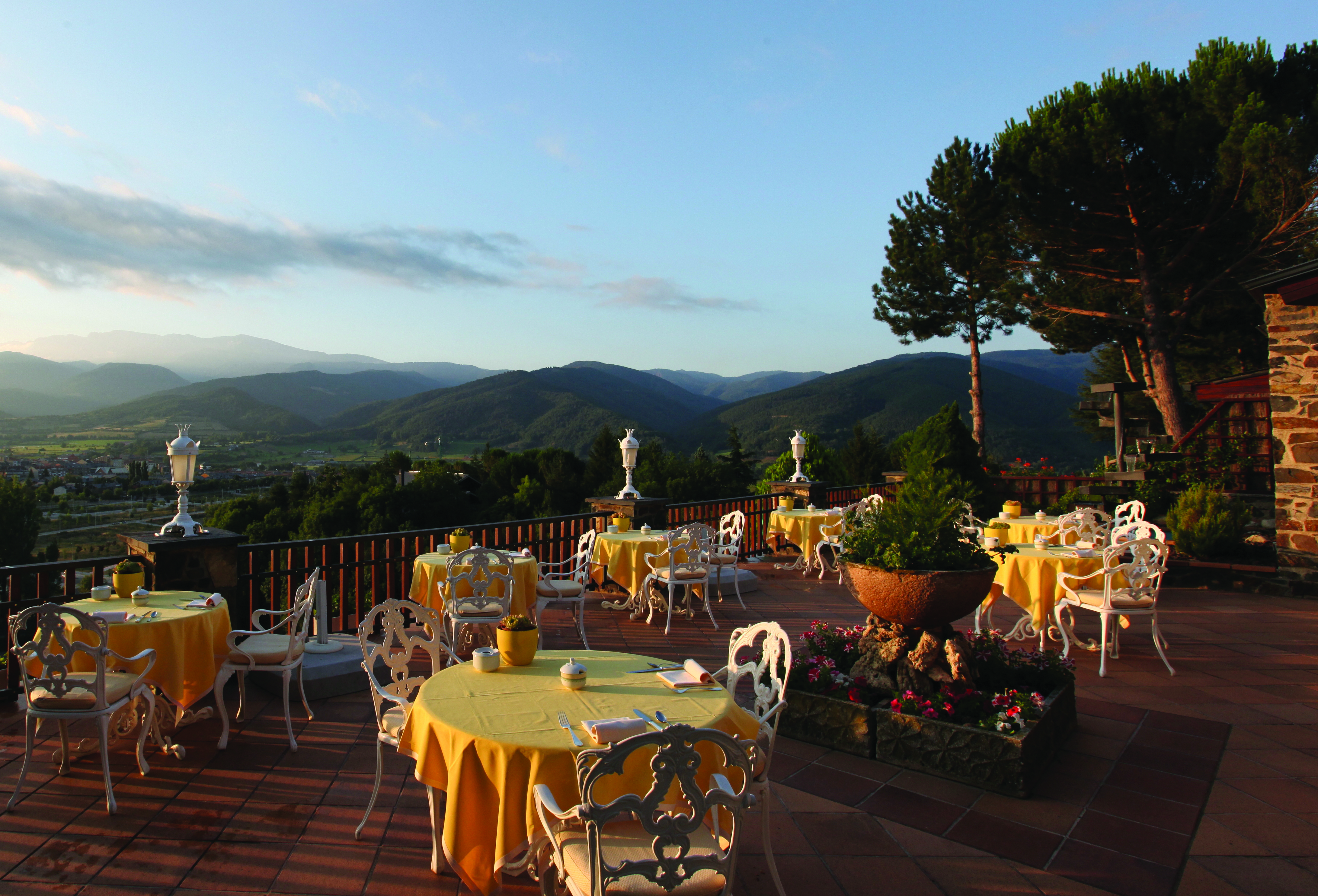 Hotel el Castell de Ciutat Catalonia outdoor dining at night lights flowers