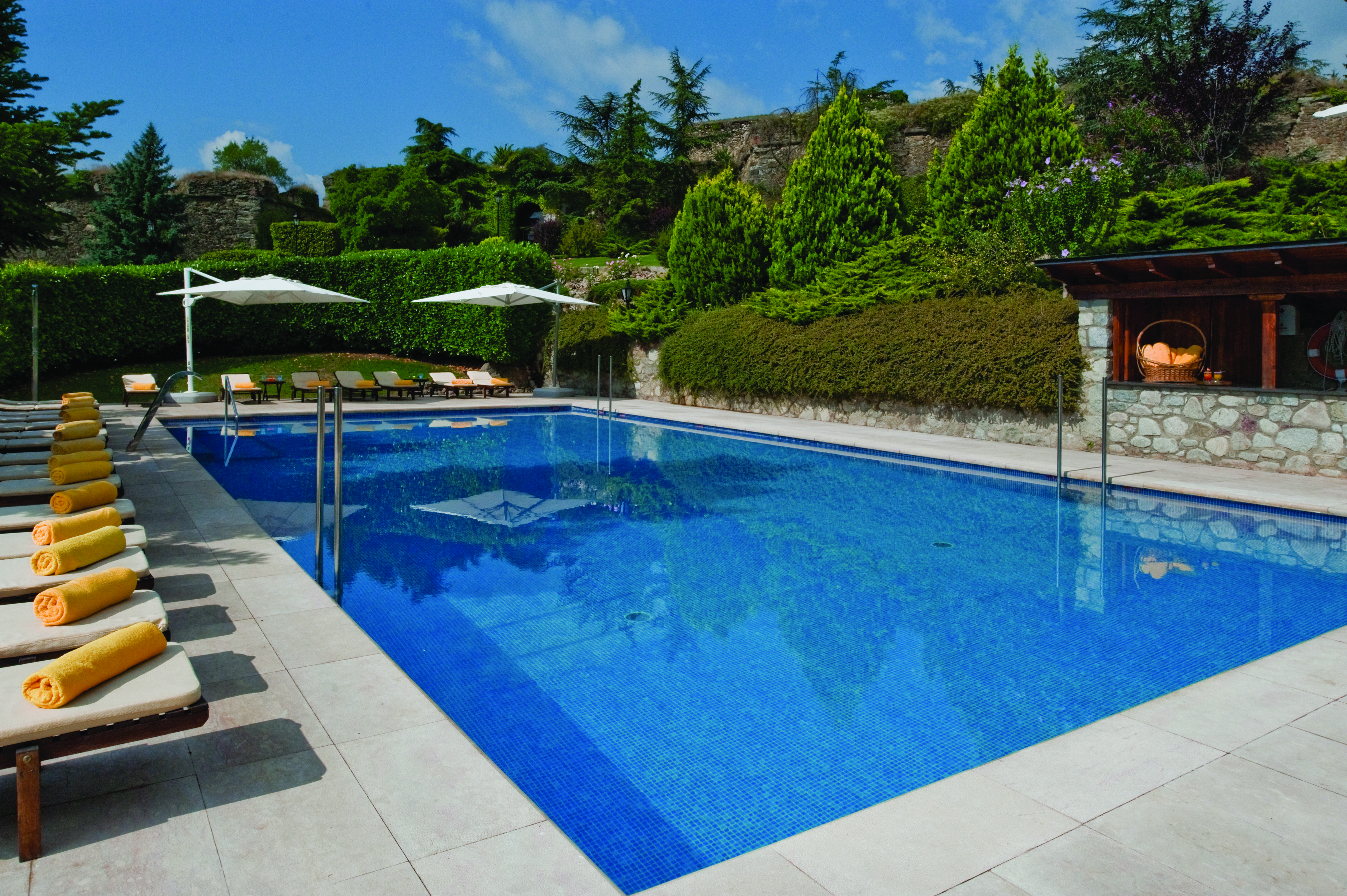 Hotel el Castell de Ciutat Catalonia pool sun loungers umbrellas