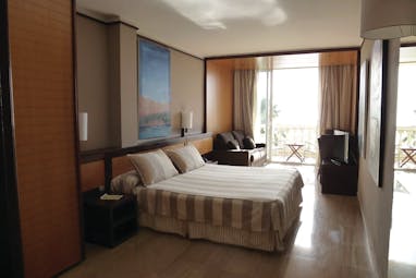 Hotel Estela Eastern Spain deluxe room bed sofa balcony contemporary décor