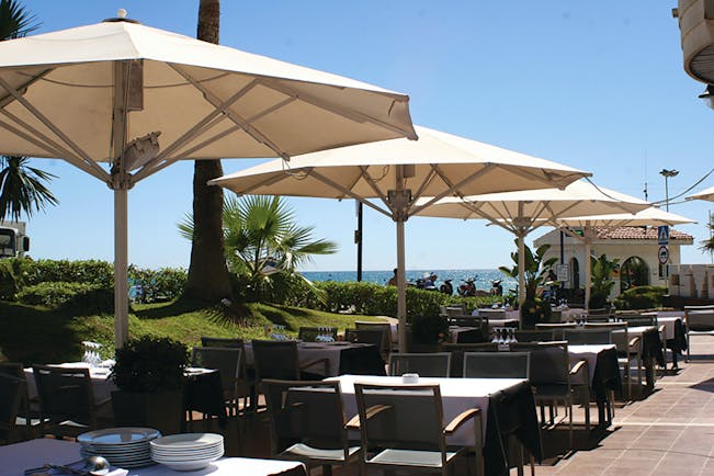 Hotel Estela Eastern Spain terrace outdoor dining area umbrellas sea views