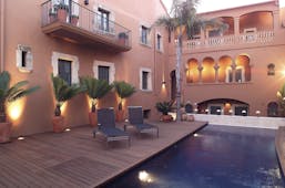 Gran Claustre Eastern Spain exterior pool sun loungers balcony potted plants