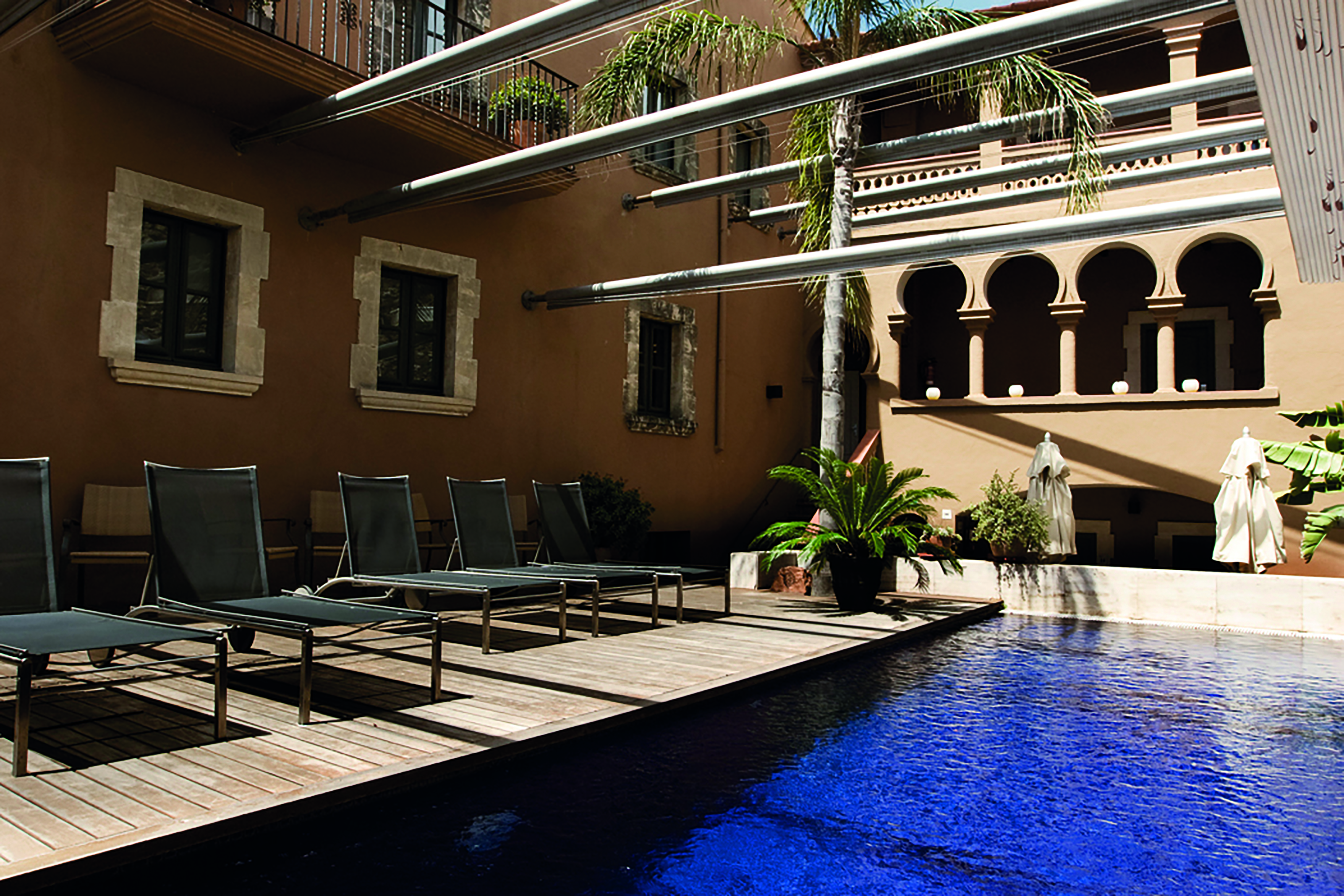 Gran Claustre Eastern Spain pool sun loungers hotel building