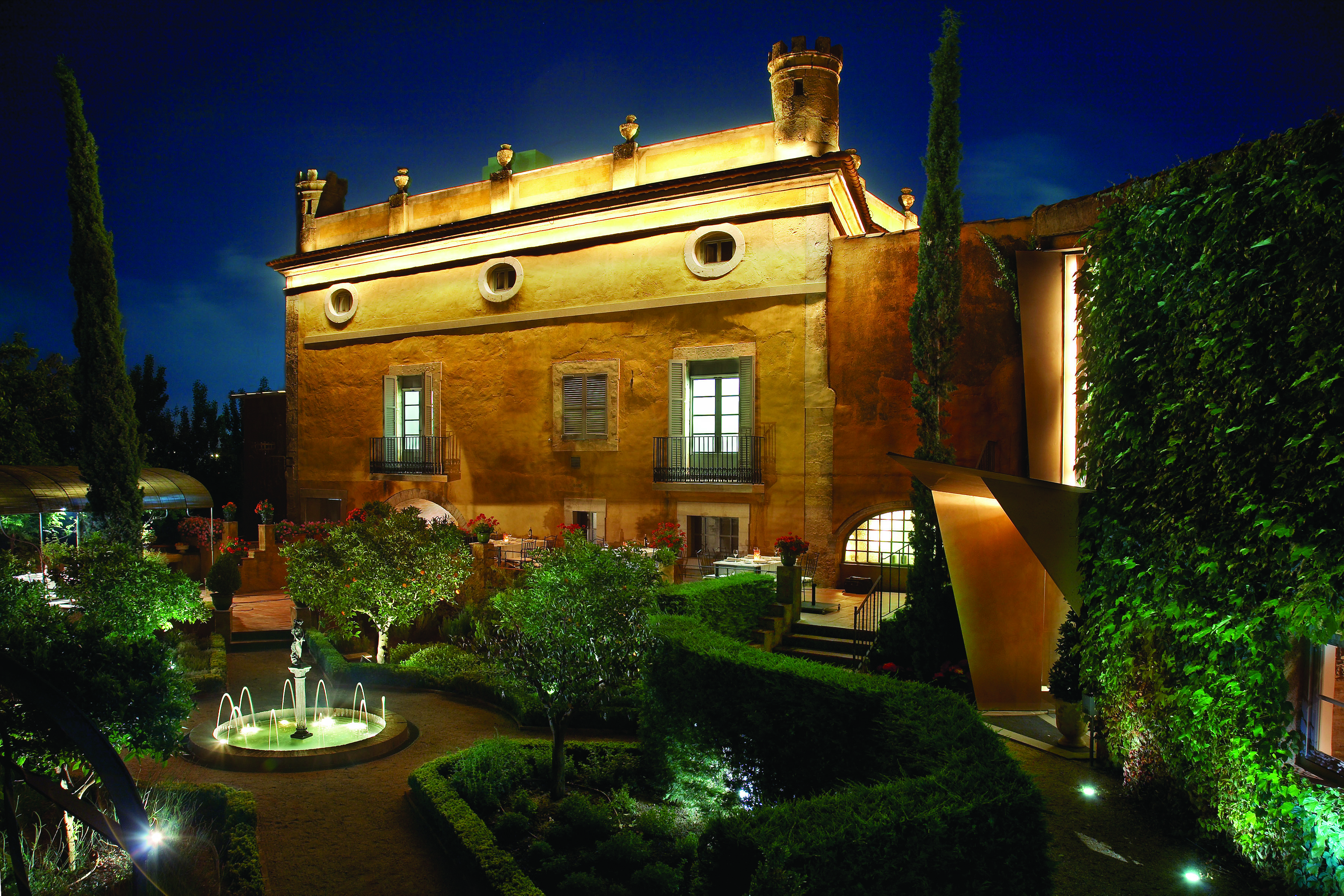 Hotel Mas la Boella Eastern Spain gardens at night hotel building garden trees shrubbery