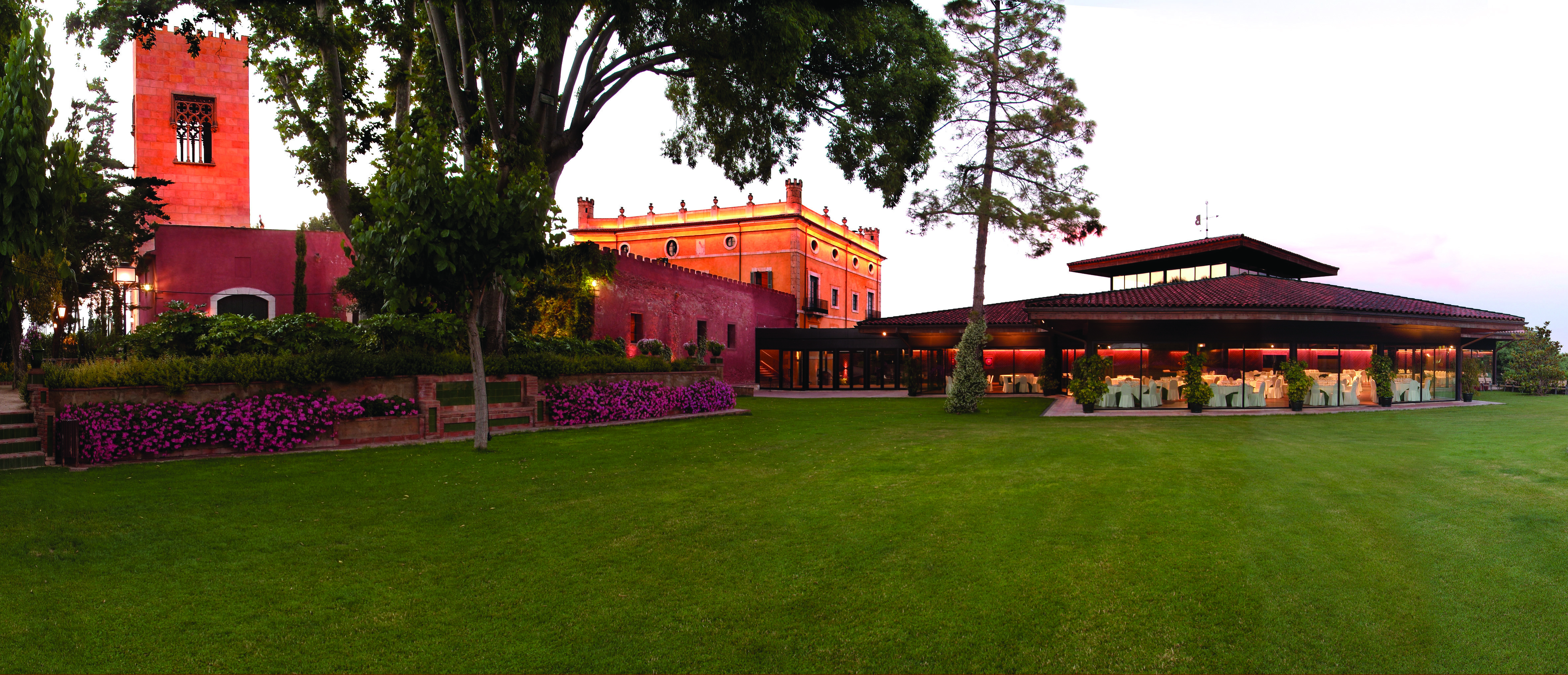 Hotel Mas la Boella Eastern Spain grounds lawn trees hotel in background