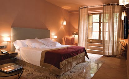 Hotel Mas la Boella Eastern Spain suite bedroom bed large windows cosy décor