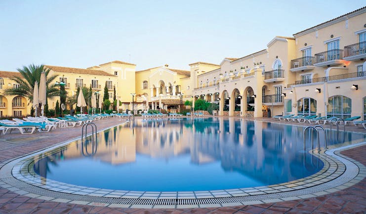 La Manga Club Resort Eastern Spain outdoor pool white hotel building sun loungers and umbrellas