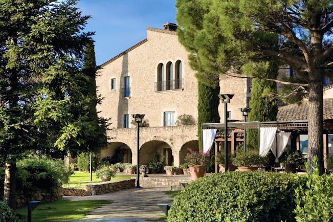 Mas de Torrent Catalonia hotel exterior building lawn trees pathway