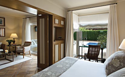 Mas de Torrent Catalonia pool suite bedroom lounge modern décor doors leading to private pool