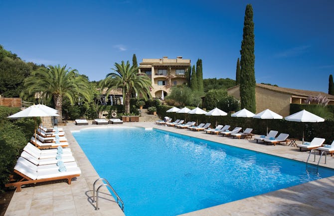 Mas de Torrent Catalonia pool sun loungers umbrellas palm trees