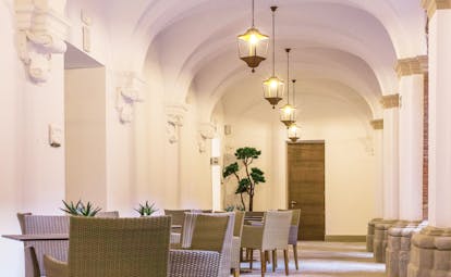 Parador de Lleida dining, tables and chairs, lights, clean and modern decor