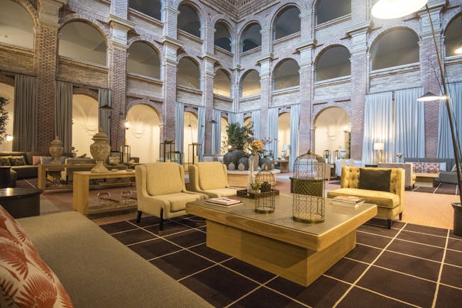 Parador de Lleida lobby lounge, tables, chairs, sofas, traditional architecture, tiled floors