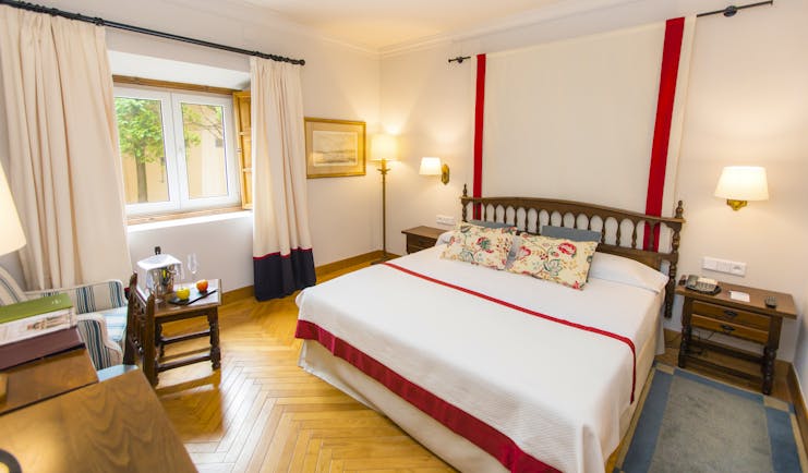 Parador de Ribadeo standard room, double bed, wooden floor, traditional decor
