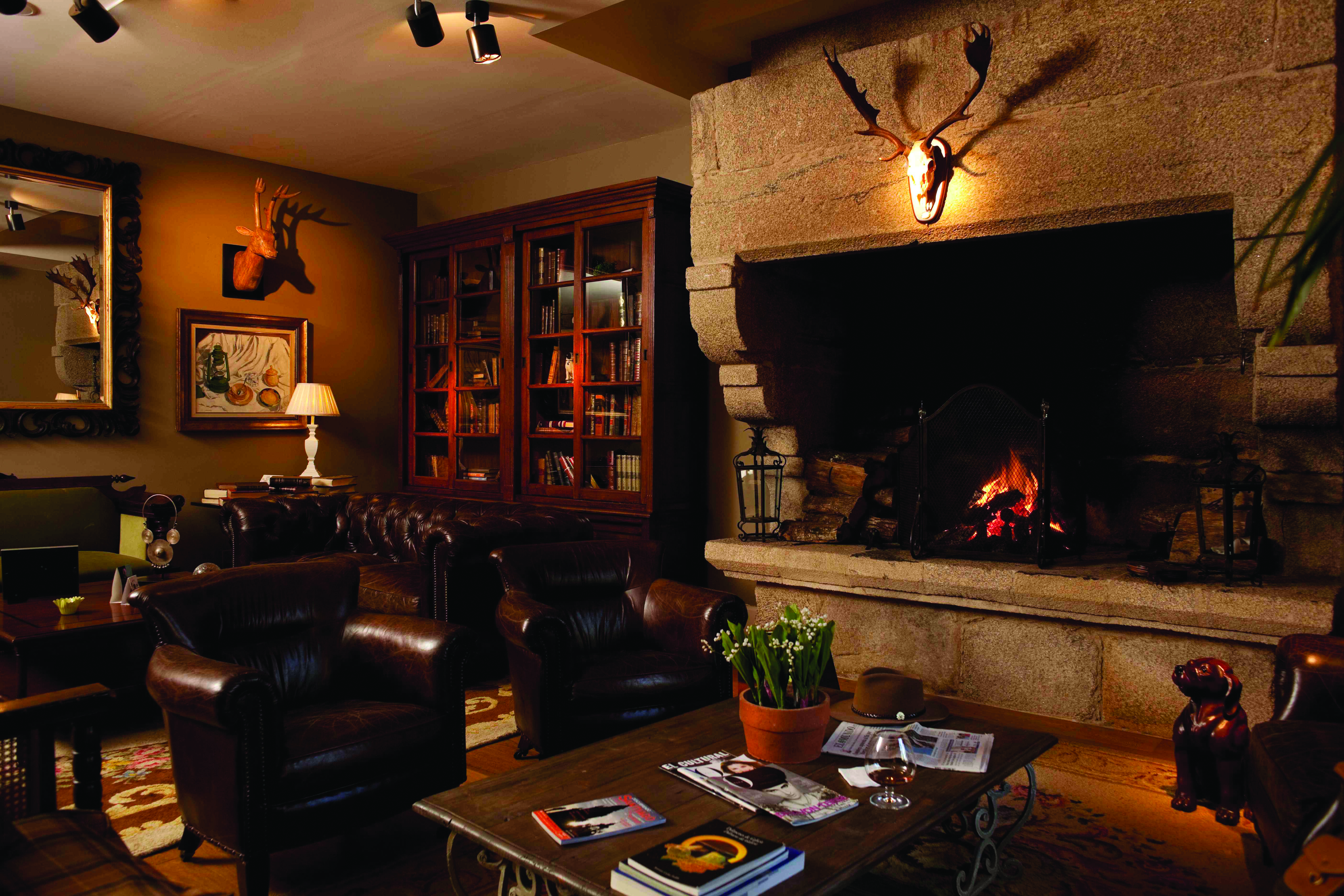A Quinta Da Auga Galicia lounge communal seating area fireplace traditional rustic décor