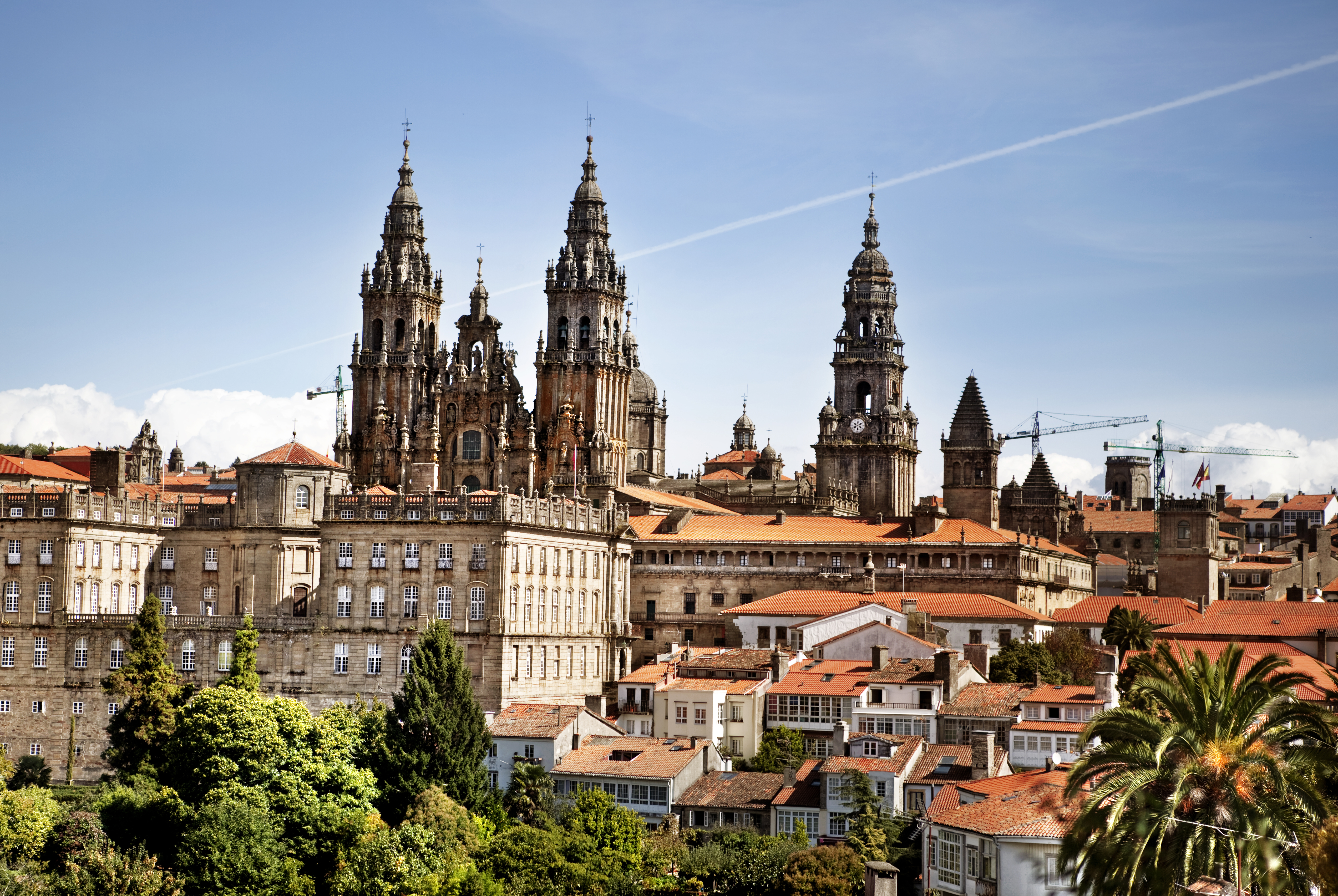 Towers of the cathedral above the red roofs of the town of Santiago de Compostela