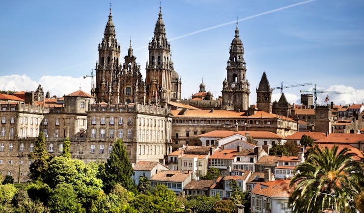 Towers of the cathedral above the red roofs of the town of Santiago de Compostela