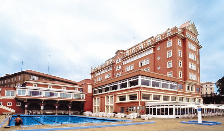 Hesperia Finisterre Green Spain pool hotel in background