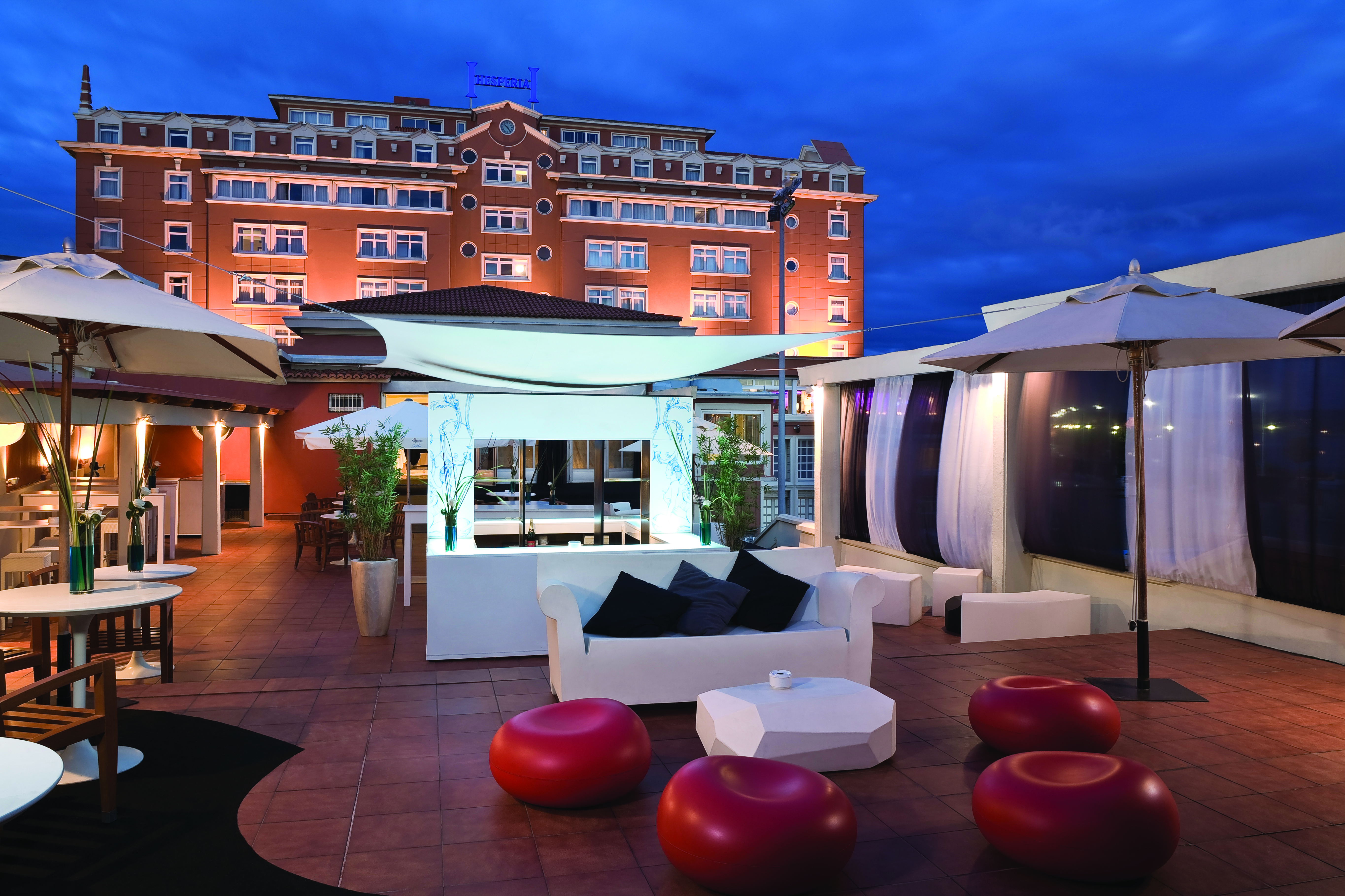 Hesperia Finisterre Green Spain terrace bare outdoor seating area sofas chairs